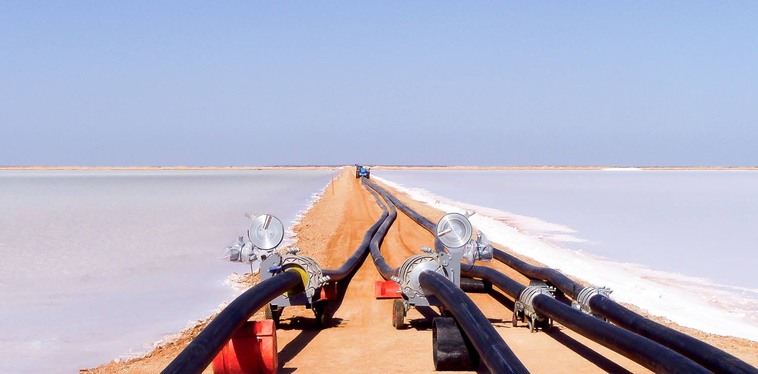 Fusion staff installing large bore PE pipework at a salt lake in rural Australia