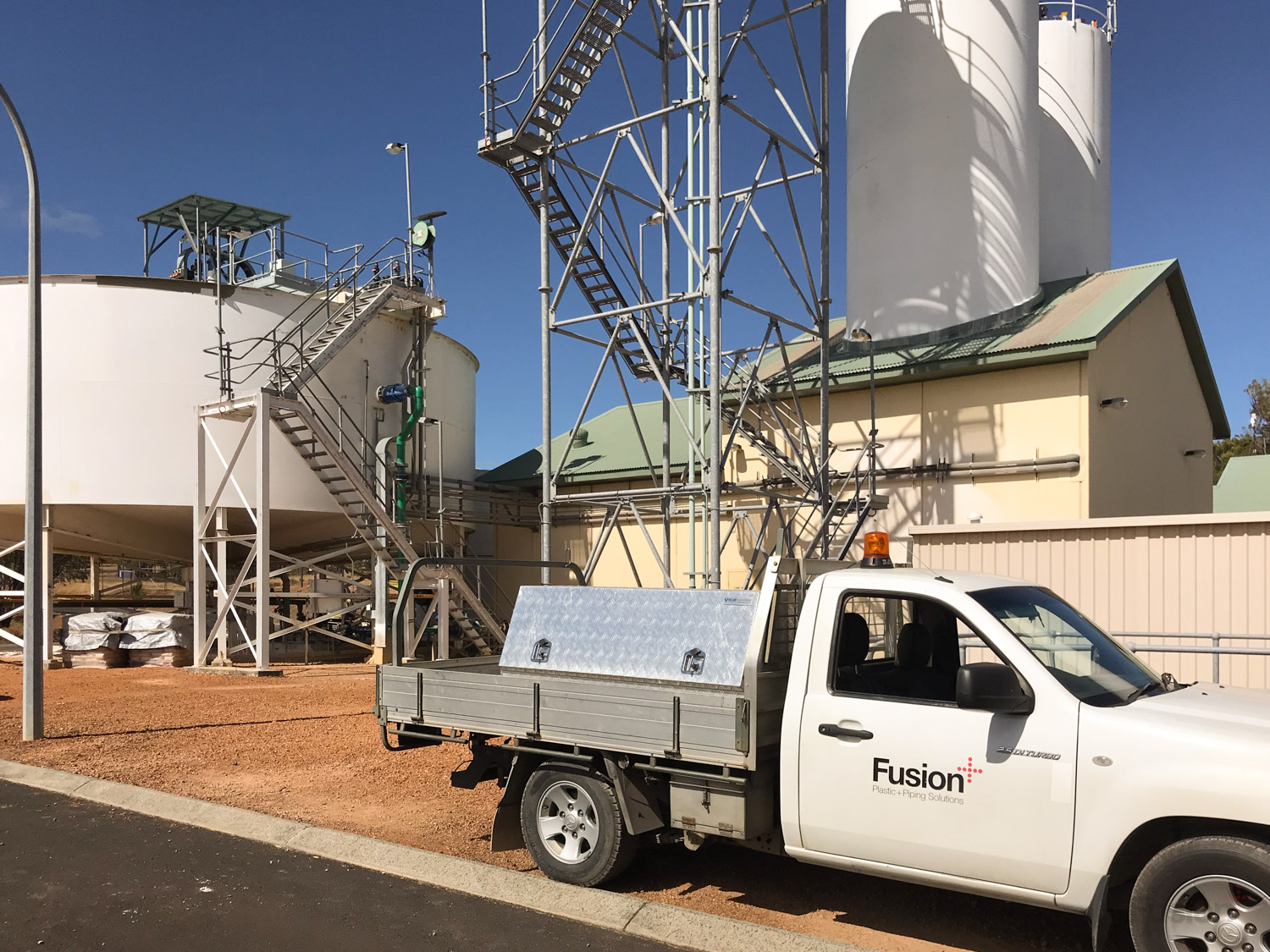 A Fusion site vehicle parked in front of the Harvey Dam Dosing Plant