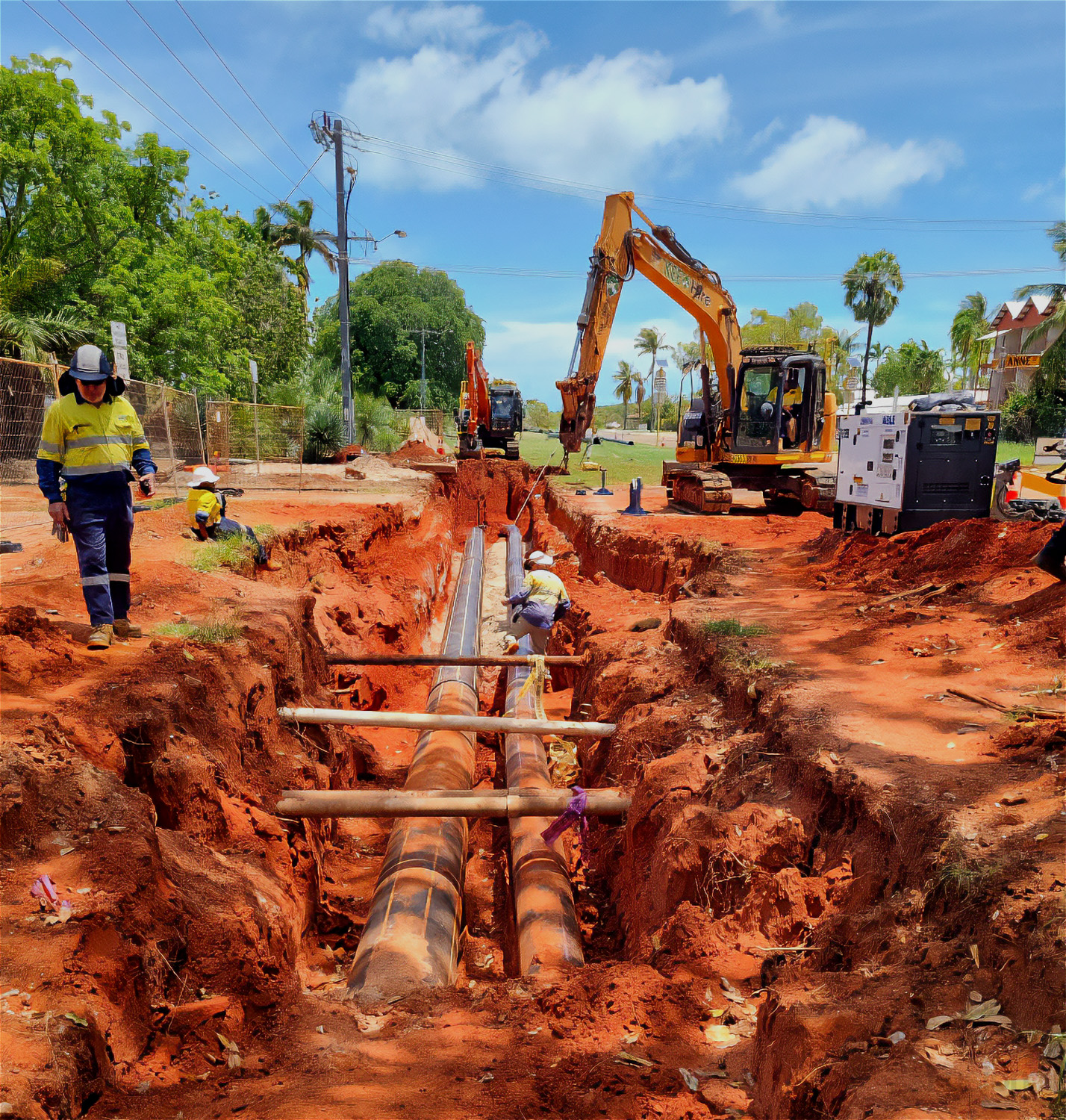 HDPE SDR11 sewer pipeline being installed underground in Broome with excavator in background
