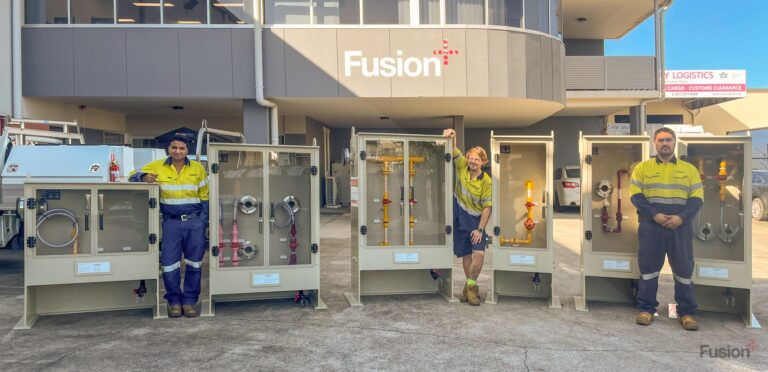 Fusion QLD staff posing with recently made PP chemical dosing panels